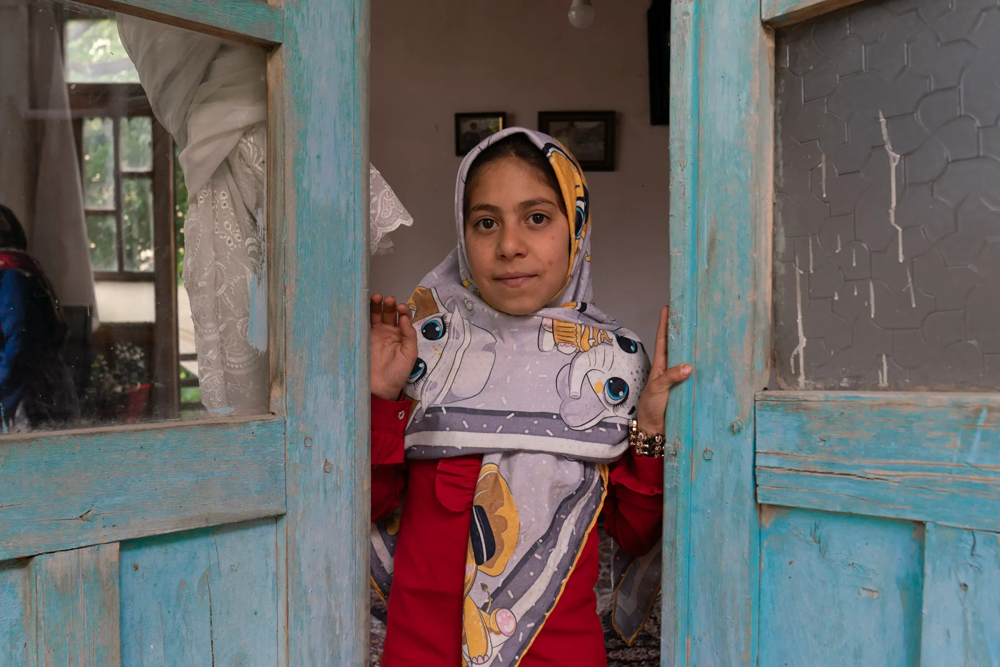 Girl at the Turquoise Door